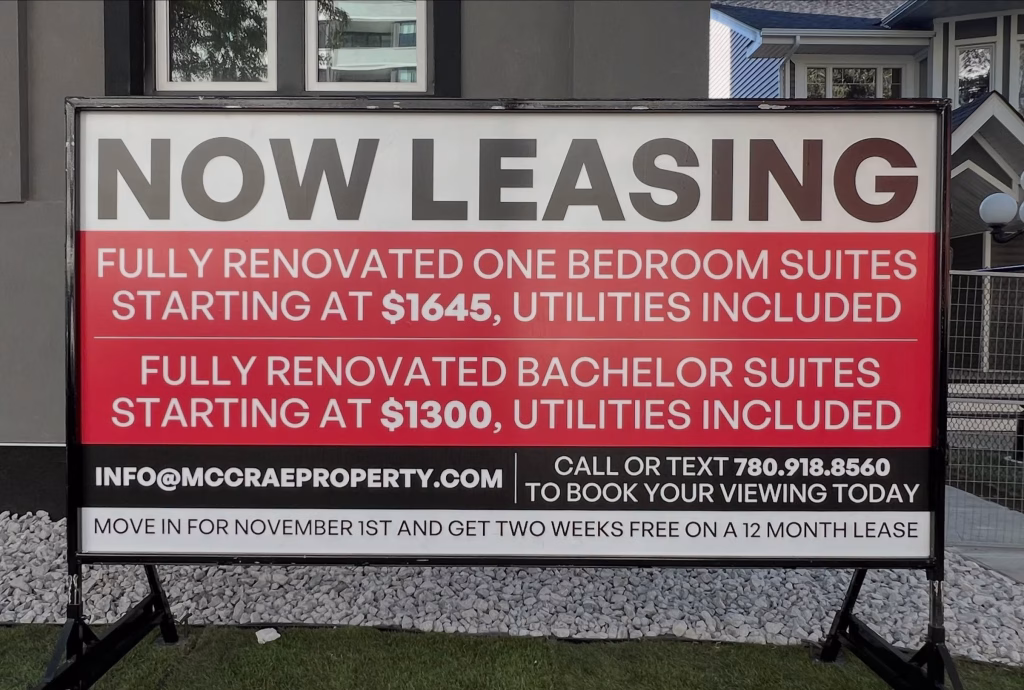 Real estate signs displaying property information and agent branding in Edmonton